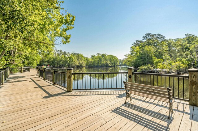 wooden deck with a water view