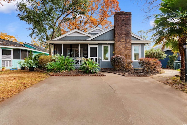 view of front of home with a sunroom