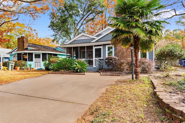 view of front of house featuring a sunroom