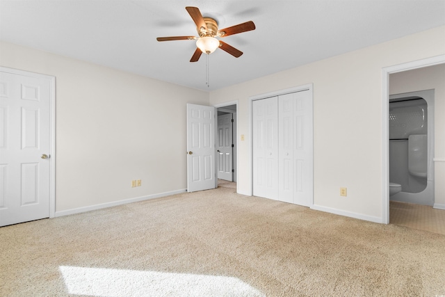 unfurnished bedroom featuring carpet flooring, connected bathroom, and ceiling fan