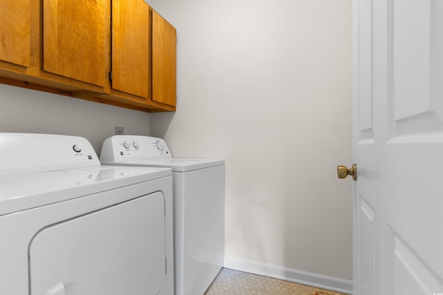 laundry room featuring cabinets and independent washer and dryer