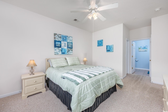 bedroom featuring ceiling fan and light carpet