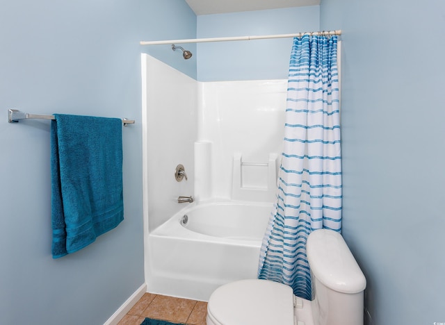 bathroom featuring tile patterned floors, shower / bathtub combination with curtain, and toilet