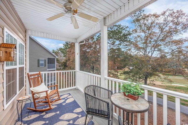 balcony with ceiling fan and covered porch