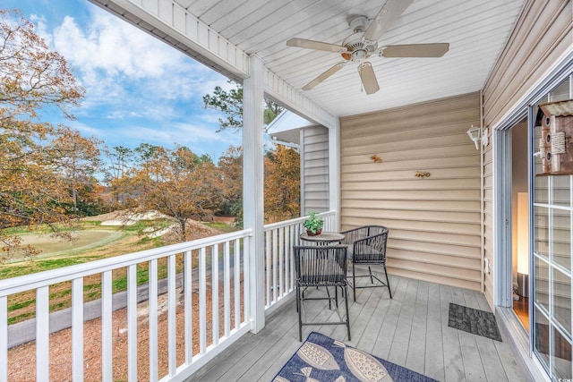 wooden terrace featuring ceiling fan