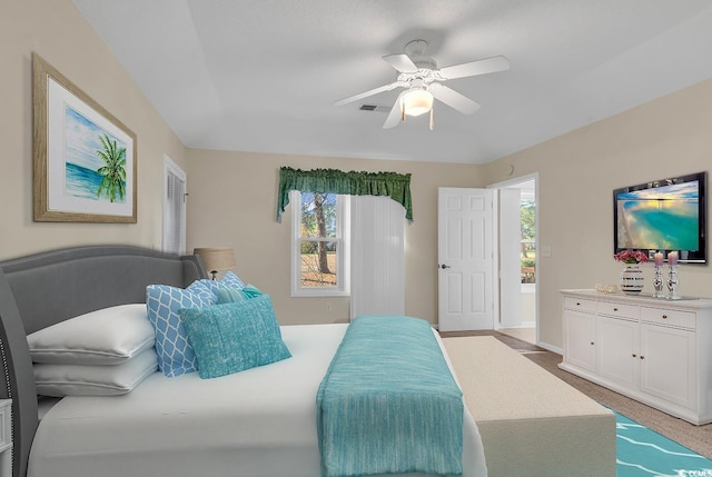 carpeted bedroom with ceiling fan