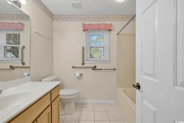 full bathroom with tile patterned flooring, vanity, a textured ceiling, and toilet