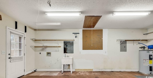 laundry room featuring electric water heater, electric panel, hookup for a washing machine, a textured ceiling, and hookup for an electric dryer