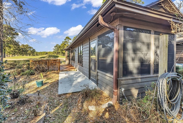 view of property exterior featuring a patio