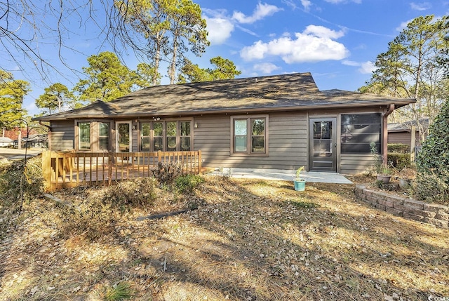 rear view of property with a deck