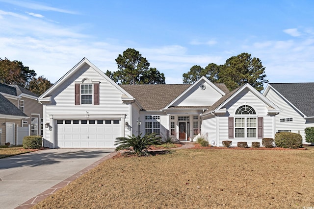 126 Pickering Dr, Murrells Inlet, SC 29576 - traditional home featuring concrete driveway, a front yard, a garage, and roof with shingles