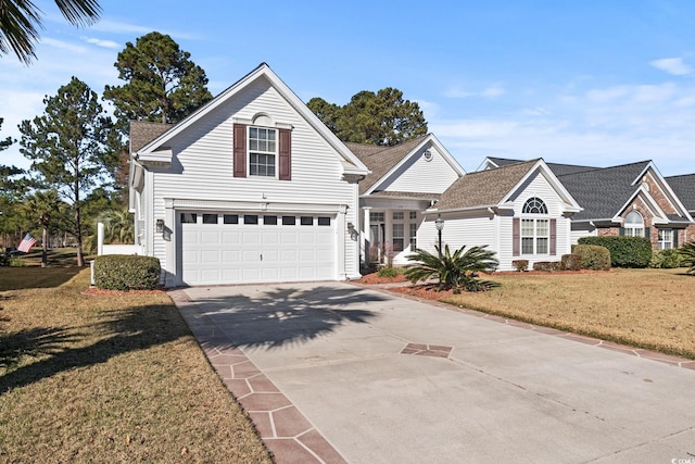 view of front property with a garage and a front lawn