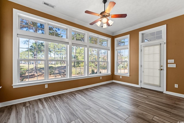 126 Pickering Dr, Murrells Inlet, SC 29576 - unfurnished sunroom with healthy amount of natural light, crown molding, baseboards, and wood finished floors