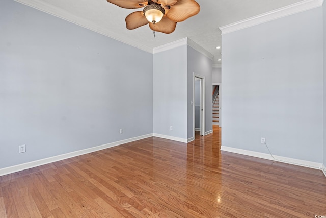 spare room featuring ceiling fan, ornamental molding, and hardwood / wood-style flooring