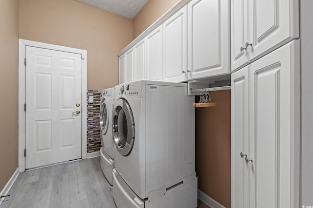 126 Pickering Dr, Murrells Inlet, SC 29576 - washroom with washer and dryer, cabinet space, light wood-style flooring, and baseboards
