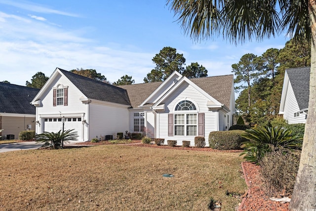 126 Pickering Dr, Murrells Inlet, SC 29576 - view of front of property featuring driveway, a front yard, roof with shingles, and a garage