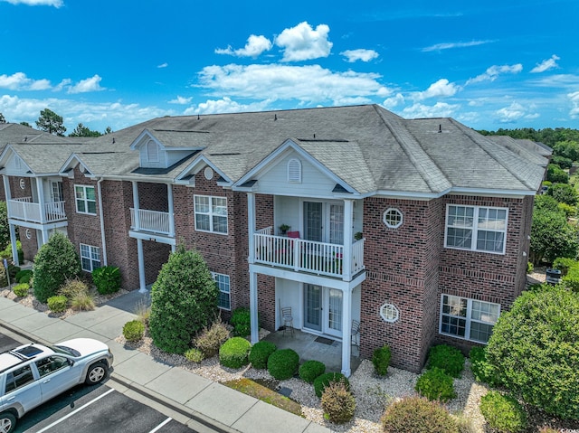 multi unit property featuring a balcony