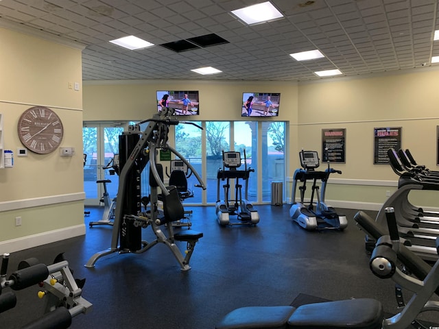 exercise room with a drop ceiling