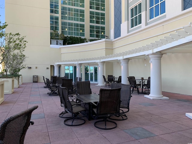 603 S Ocean Blvd Unit 1002, North Myrtle Beach, SC 29582 - view of patio featuring outdoor dining area and a pergola