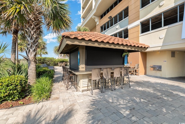 view of patio / terrace with an outdoor bar