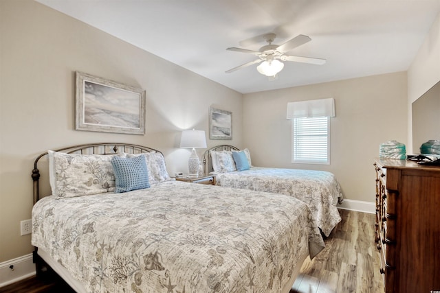 603 S Ocean Blvd Unit 1002, North Myrtle Beach, SC 29582 - bedroom featuring dark wood-style floors, baseboards, and ceiling fan