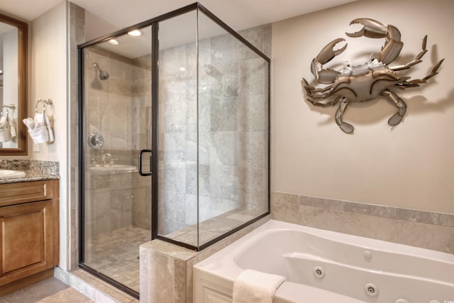603 S Ocean Blvd Unit 1002, North Myrtle Beach, SC 29582 - full bathroom featuring a jetted tub, a stall shower, vanity, and tile patterned flooring