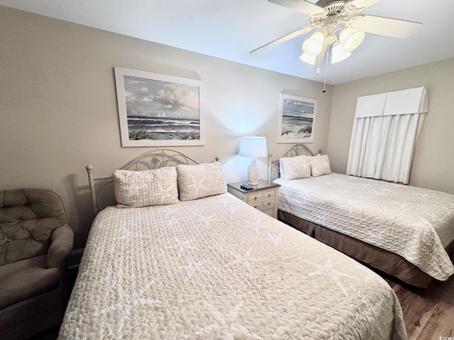 bedroom featuring ceiling fan and wood-type flooring