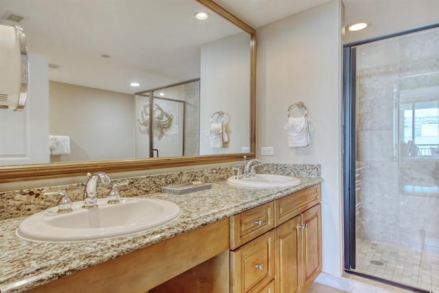 603 S Ocean Blvd Unit 1002, North Myrtle Beach, SC 29582 - bathroom with double vanity, a stall shower, and recessed lighting
