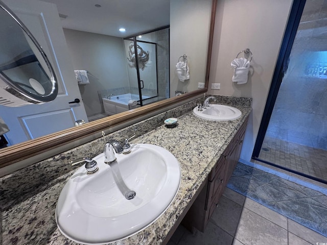 bathroom featuring tile patterned flooring, vanity, and independent shower and bath