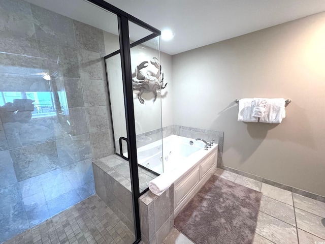 603 S Ocean Blvd Unit 1002, North Myrtle Beach, SC 29582 - full bathroom with a shower stall, a whirlpool tub, baseboards, and tile patterned floors