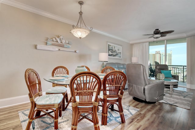 603 S Ocean Blvd Unit 1002, North Myrtle Beach, SC 29582 - dining area with crown molding, light wood finished floors, ceiling fan, and baseboards