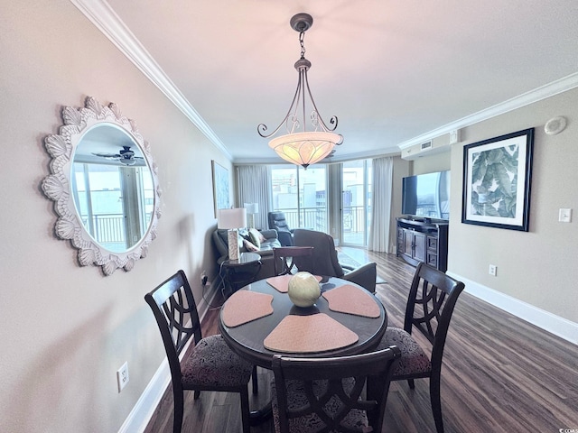 dining room with plenty of natural light, ceiling fan, dark hardwood / wood-style flooring, and ornamental molding