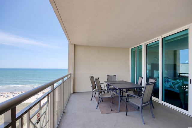 603 S Ocean Blvd Unit 1002, North Myrtle Beach, SC 29582 - balcony featuring view of water and beach and outdoor dining space
