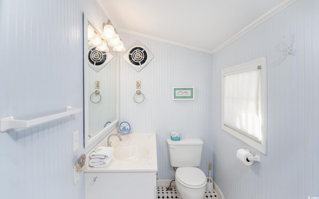 bathroom featuring vanity, toilet, and ornamental molding