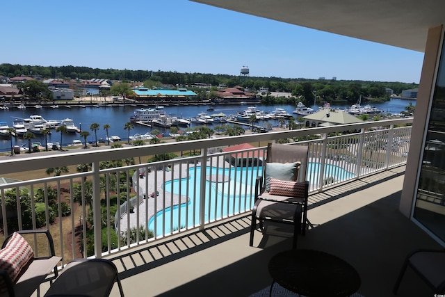 balcony featuring a water view