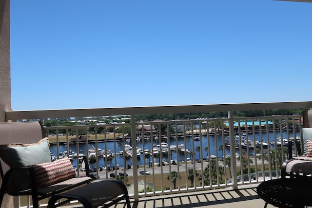 balcony featuring a water view