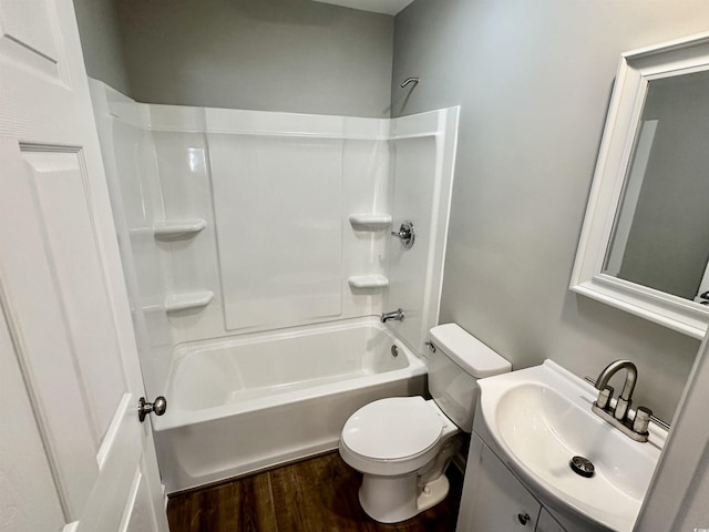 full bathroom featuring vanity, toilet, wood-type flooring, and tub / shower combination