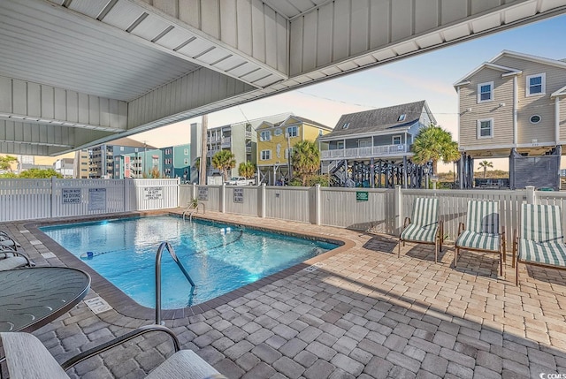 view of swimming pool with a patio