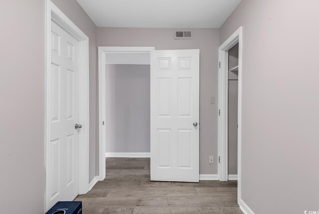 hall with light hardwood / wood-style floors