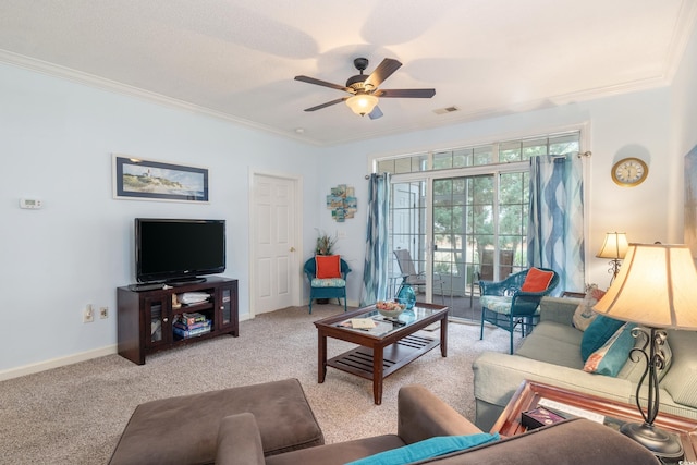 carpeted living room with ceiling fan and crown molding