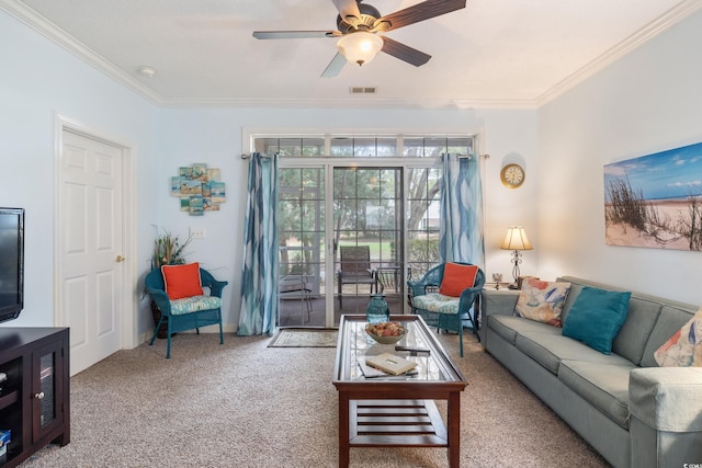 carpeted living room featuring ceiling fan and crown molding