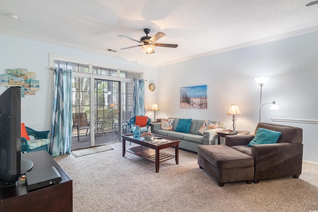 carpeted living room featuring a textured ceiling, ceiling fan, and crown molding