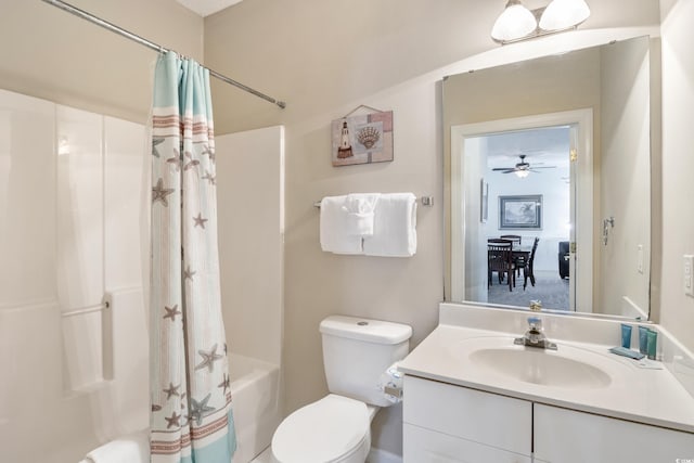 full bathroom with vanity, ceiling fan, toilet, and shower / bathtub combination with curtain