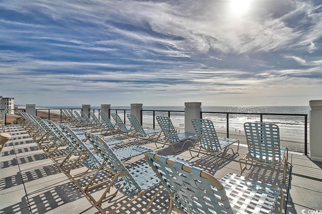 wooden deck with a water view