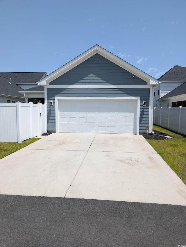 2023 Singing Palm Loop, Little River, SC 29566 - ranch-style home featuring fence and a garage