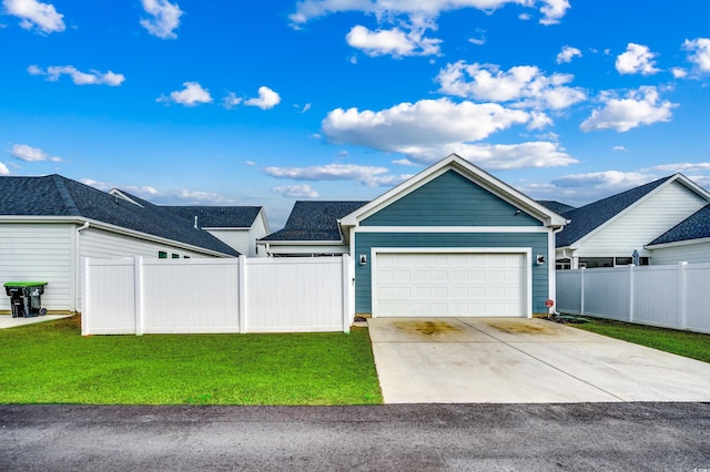 ranch-style home with an attached garage, driveway, fence, and a front lawn