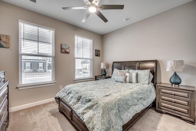 2023 Singing Palm Loop, Little River, SC 29566 - bedroom featuring light carpet, baseboards, and a ceiling fan