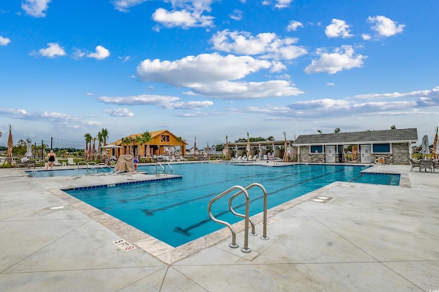 pool featuring a patio area and fence