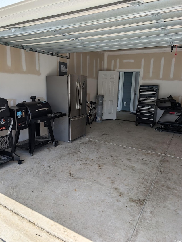 2023 Singing Palm Loop, Little River, SC 29566 - garage featuring freestanding refrigerator