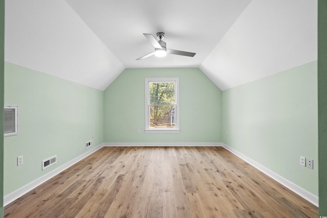 additional living space featuring ceiling fan, lofted ceiling, and light hardwood / wood-style flooring